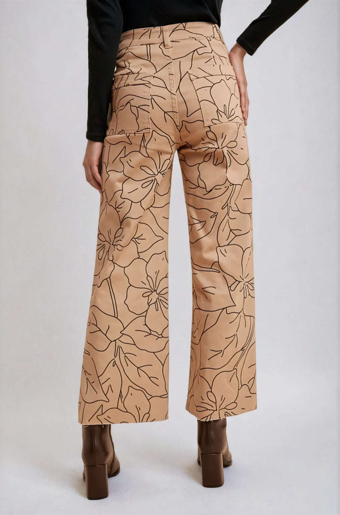 Side view taupe floral denim pants on model