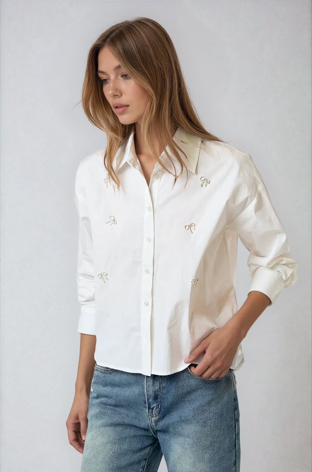 Front view off white cotton shirt with sparkly bow details