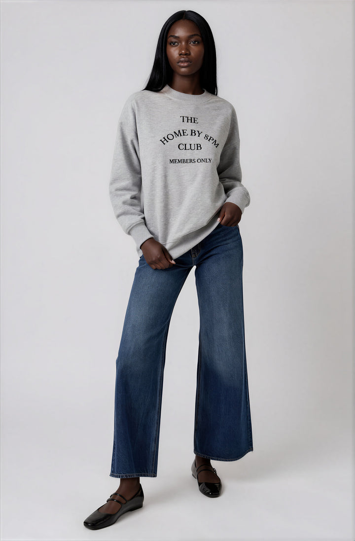 gray crewneck sweatshirt with black text