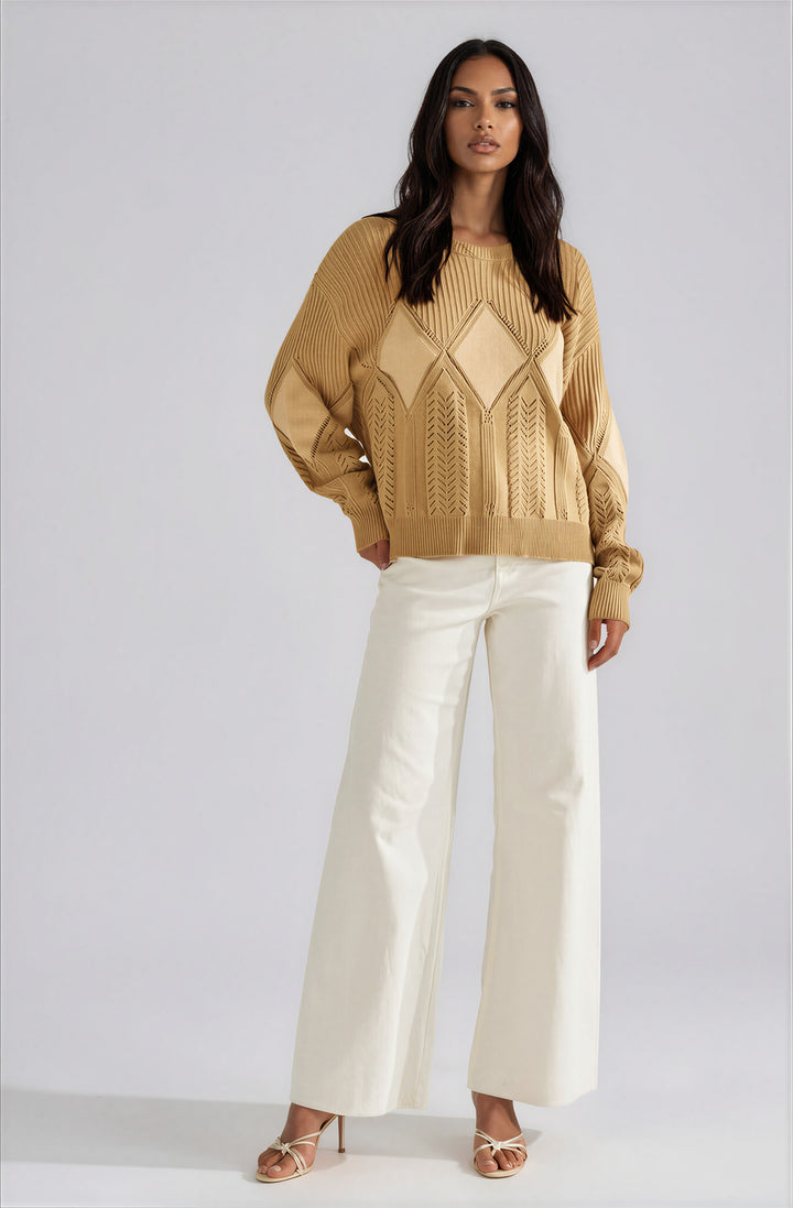 Beige textured pullover sweater with diamond knit pattern on model