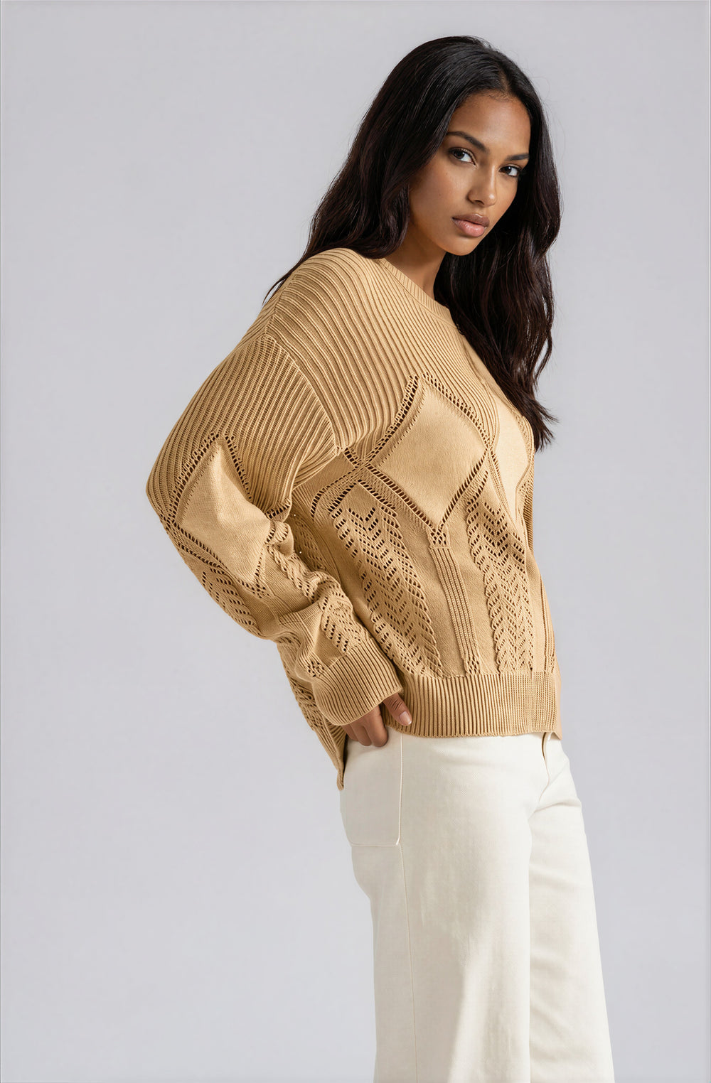 Side view beige relaxed fit sweater with dropped shoulders