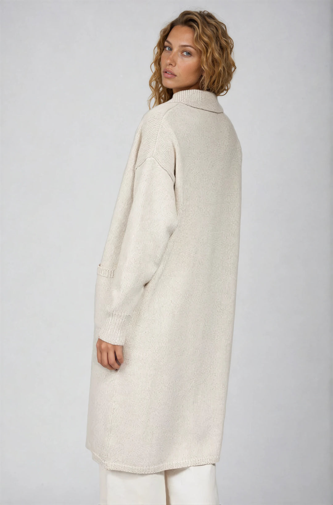 Back view taupe floral denim pants on model