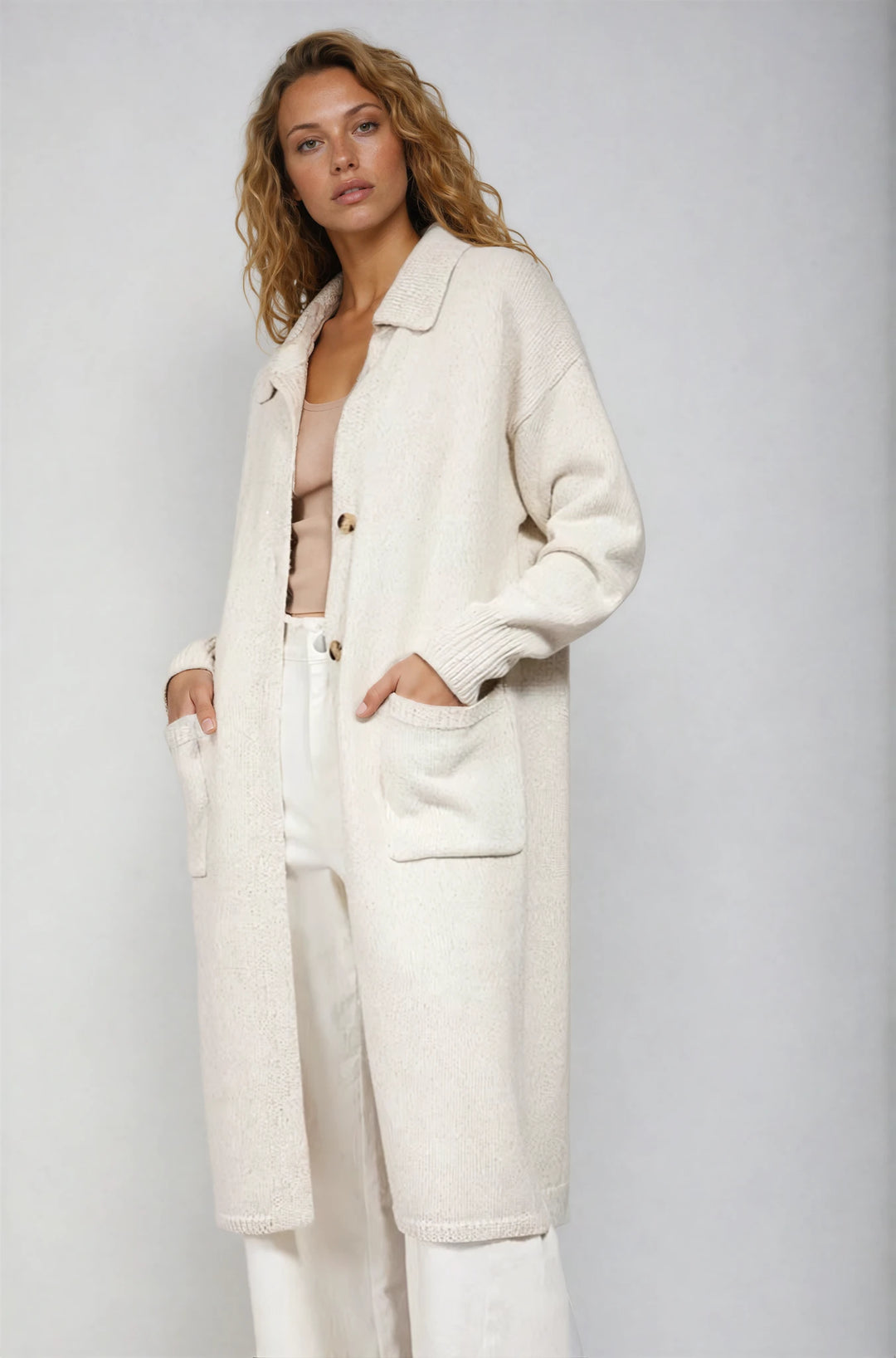 Black knit two piece set with contrast cuffs and flared skirt on model