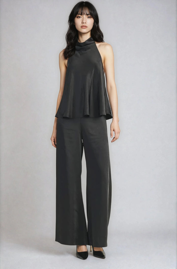 Black halter style draped mock neck blouse on model