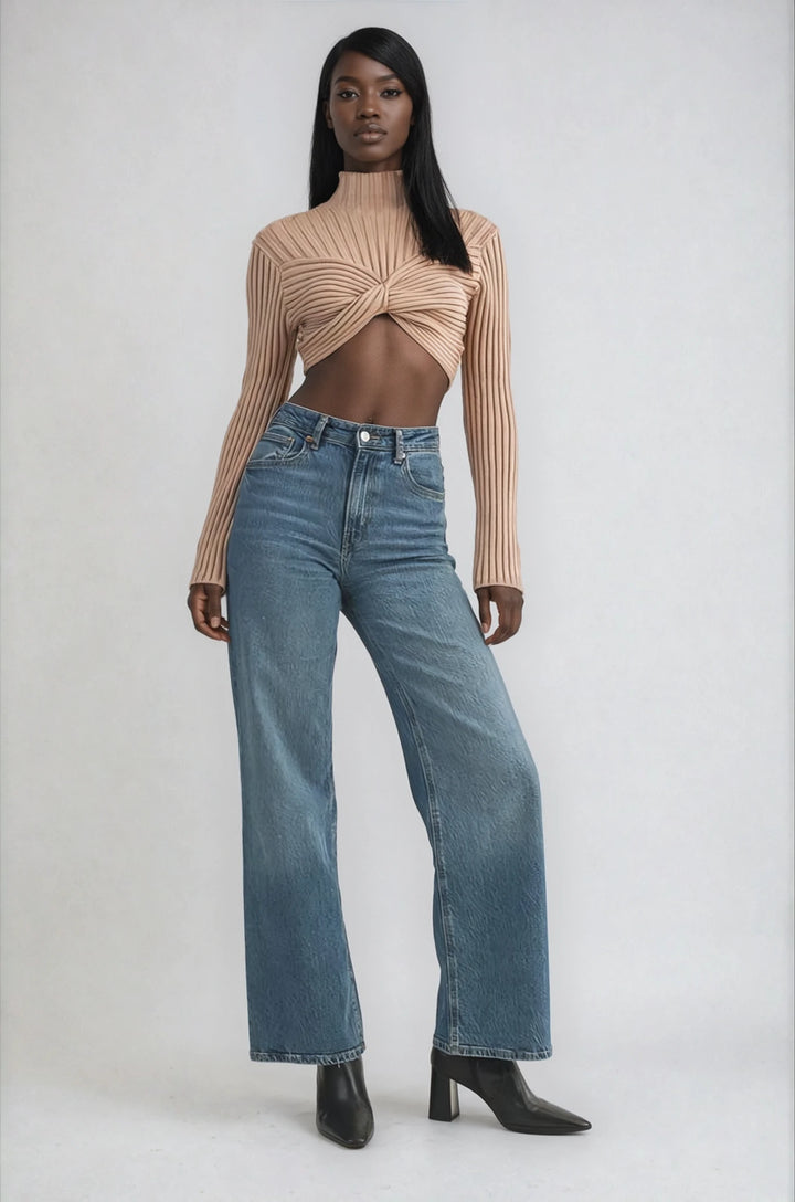 Beige ribbed knit cropped sweater with twisted front on model