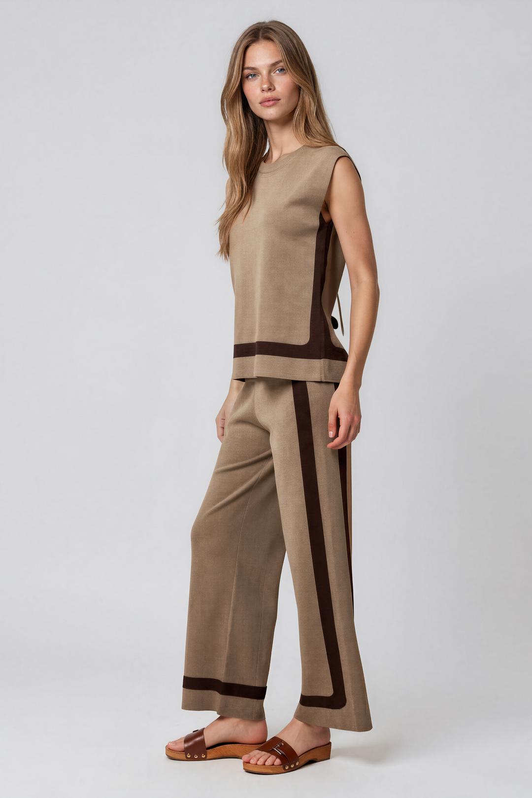 Taupe two-piece knit lounge set with sleeveless top and wide-leg pants with brown side stripes