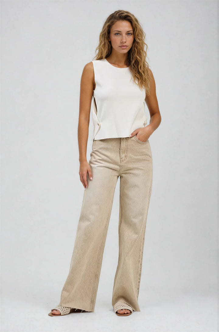 Model wearing Leanne Jeans high-rise color wash denim with wide-leg fit