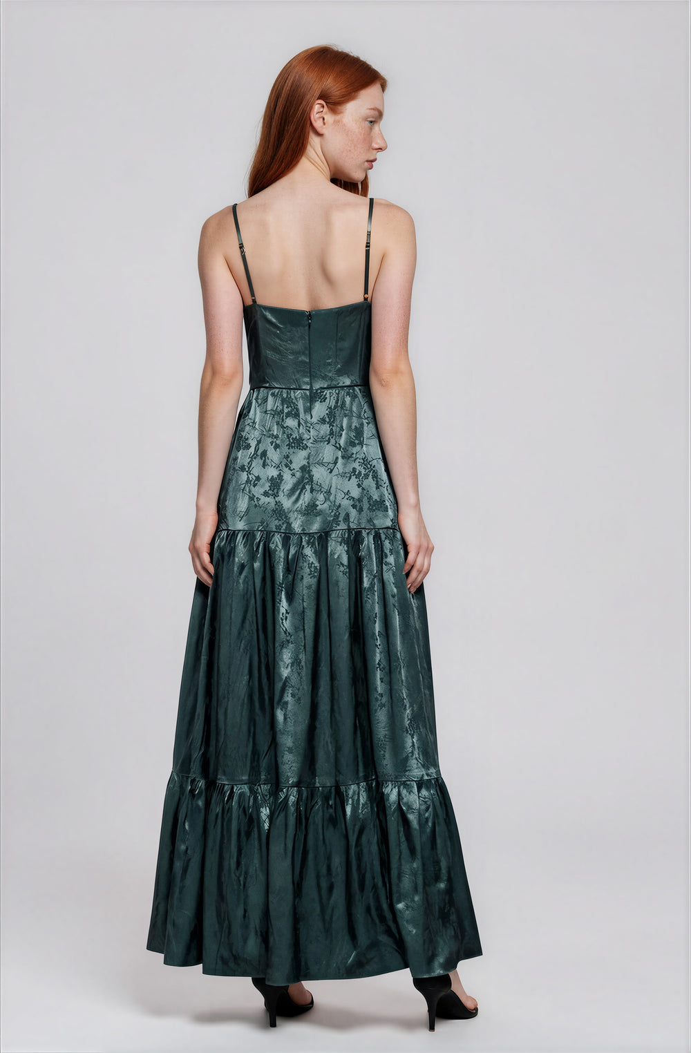 Back view dark green spaghetti strap maxi dress on model