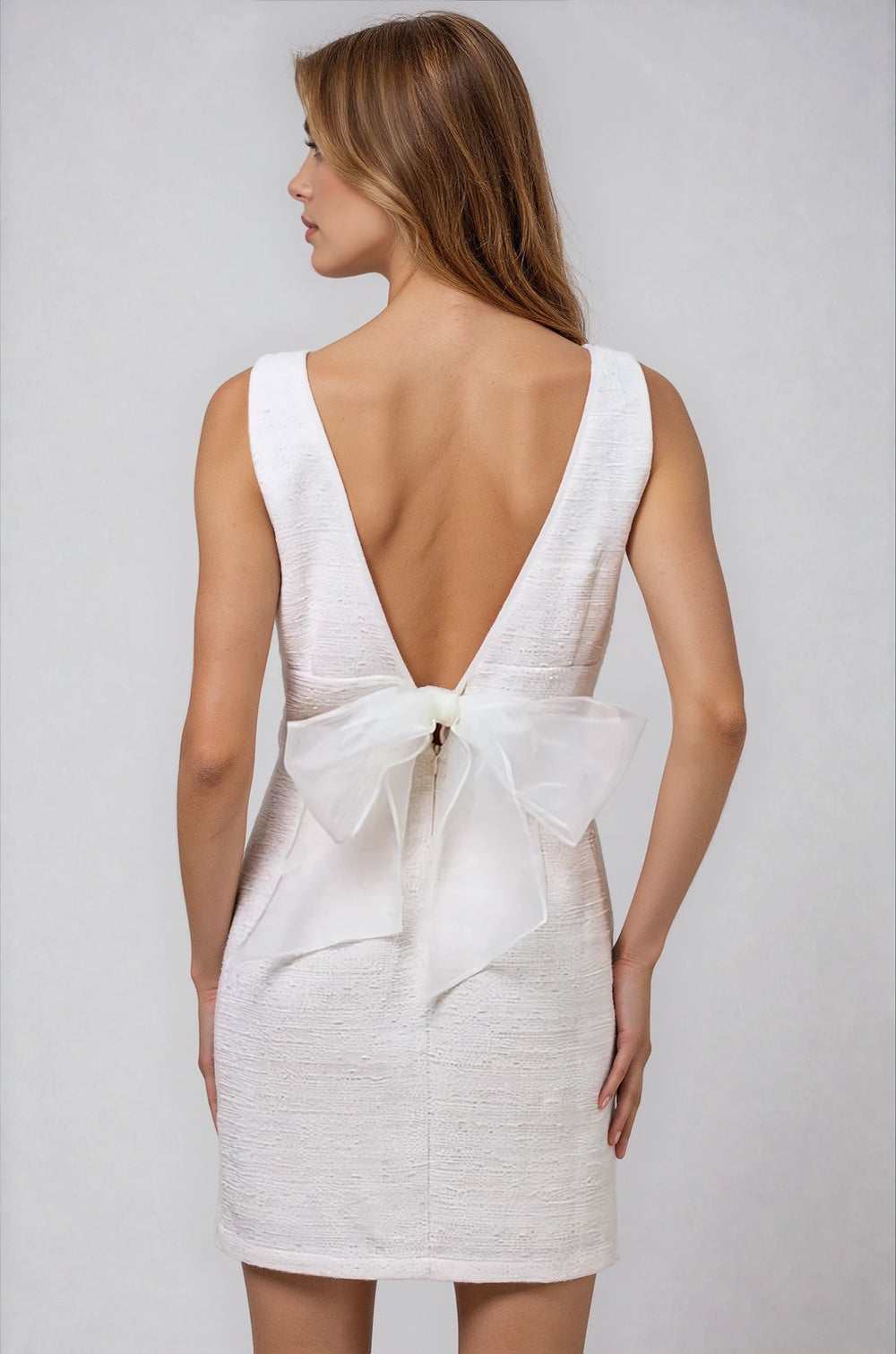 white v neck mini dress with bow detail for bride back view