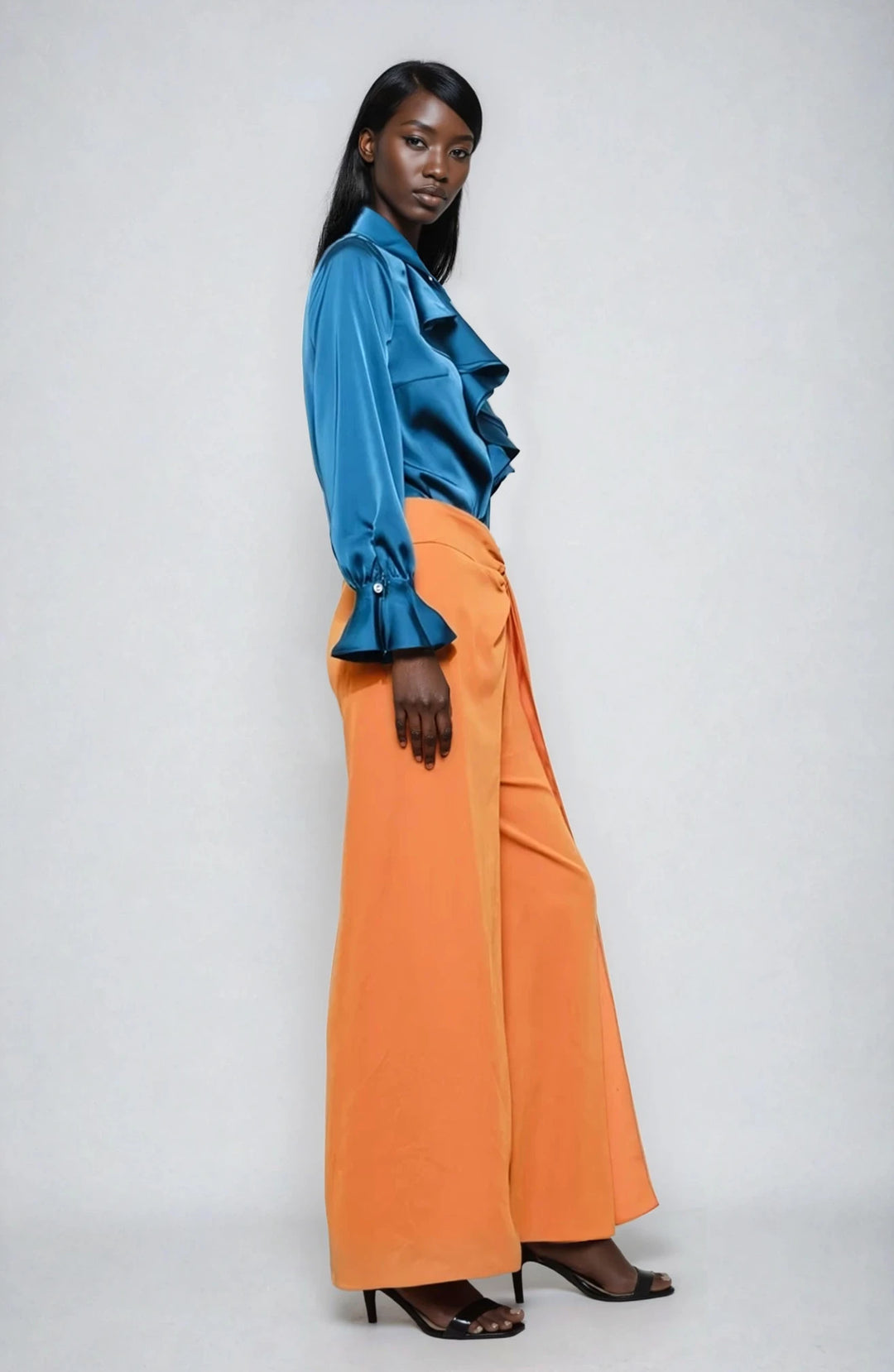 Side view blue ruffled blouse with soft flowing sleeves