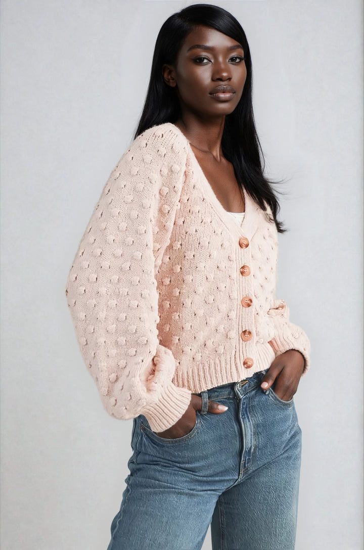 Front view pink button front cardigan with V neckline