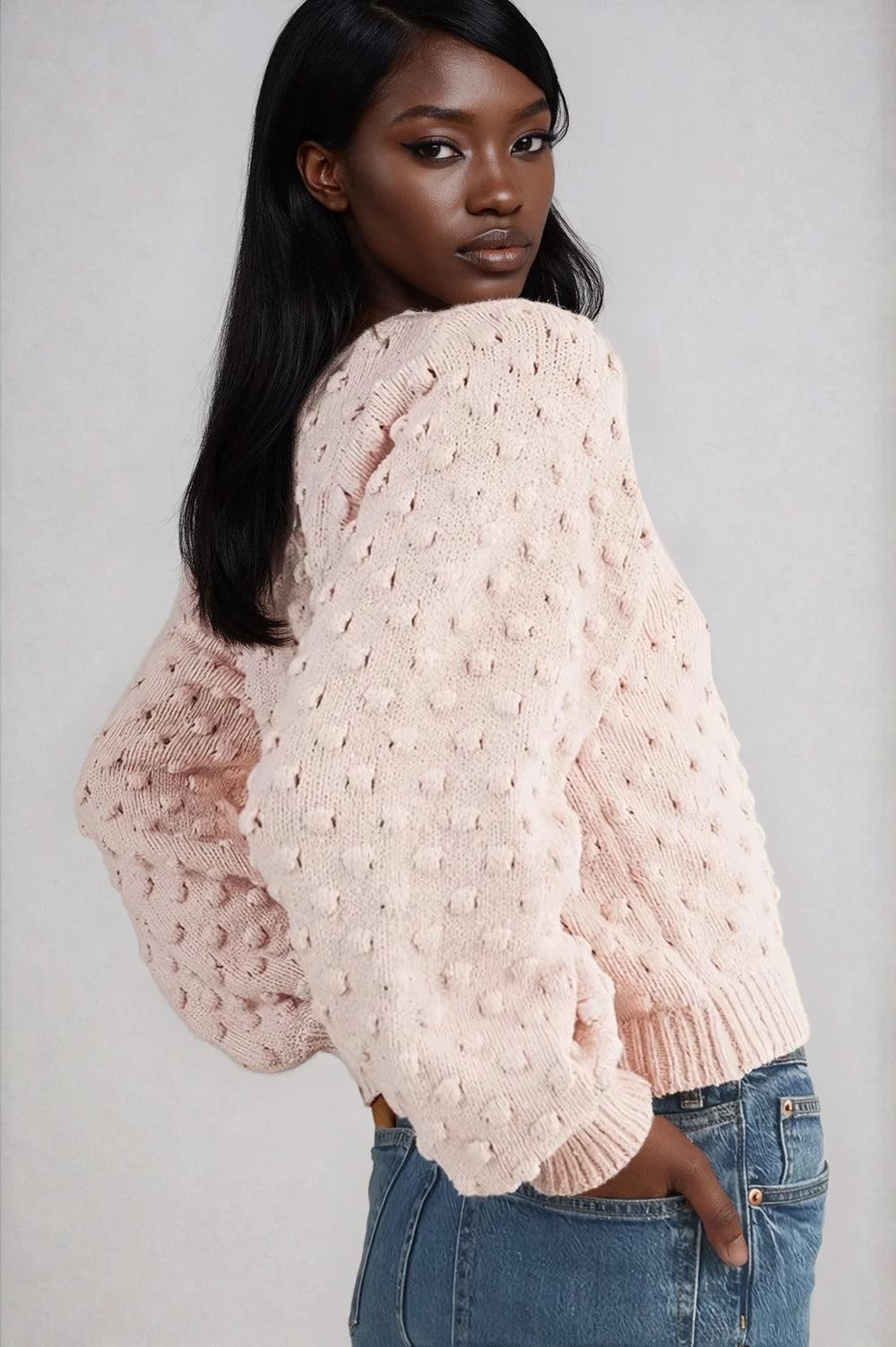 Side view pink balloon sleeve cardigan on model