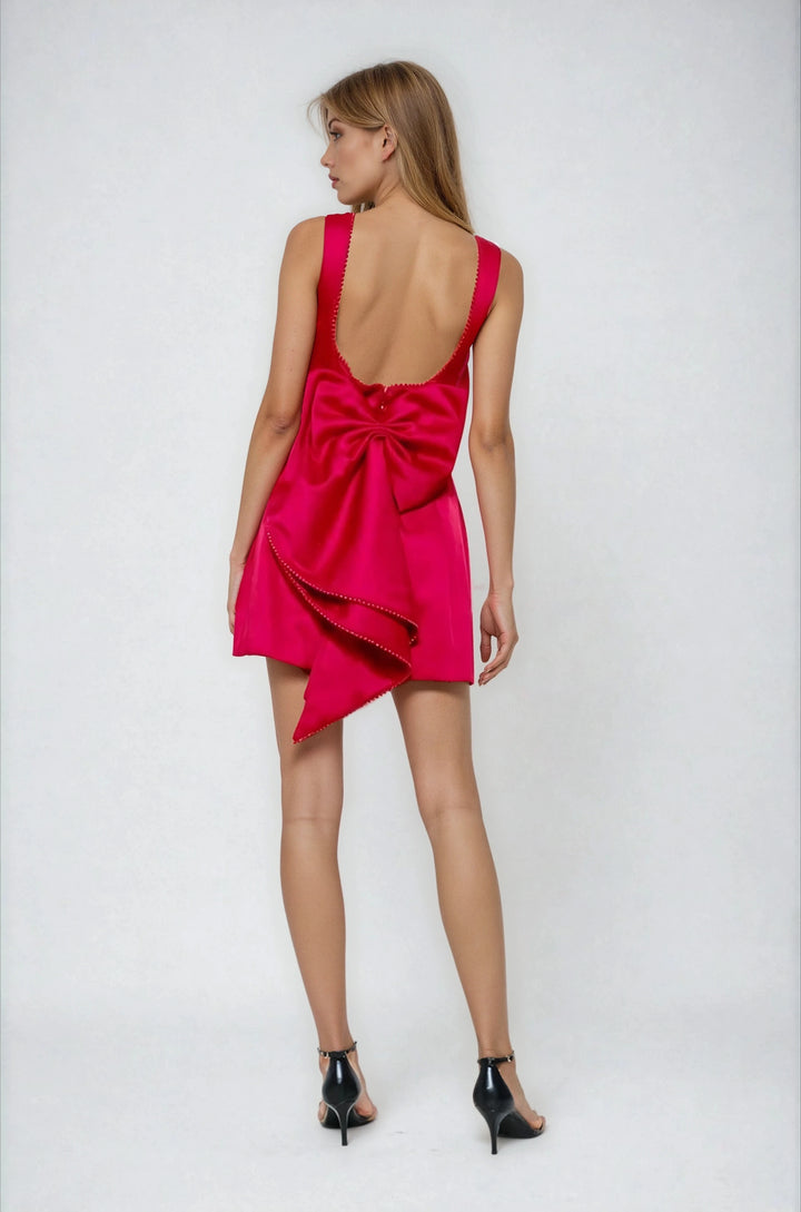 Back view red mini dress with detachable bow and pearl trim