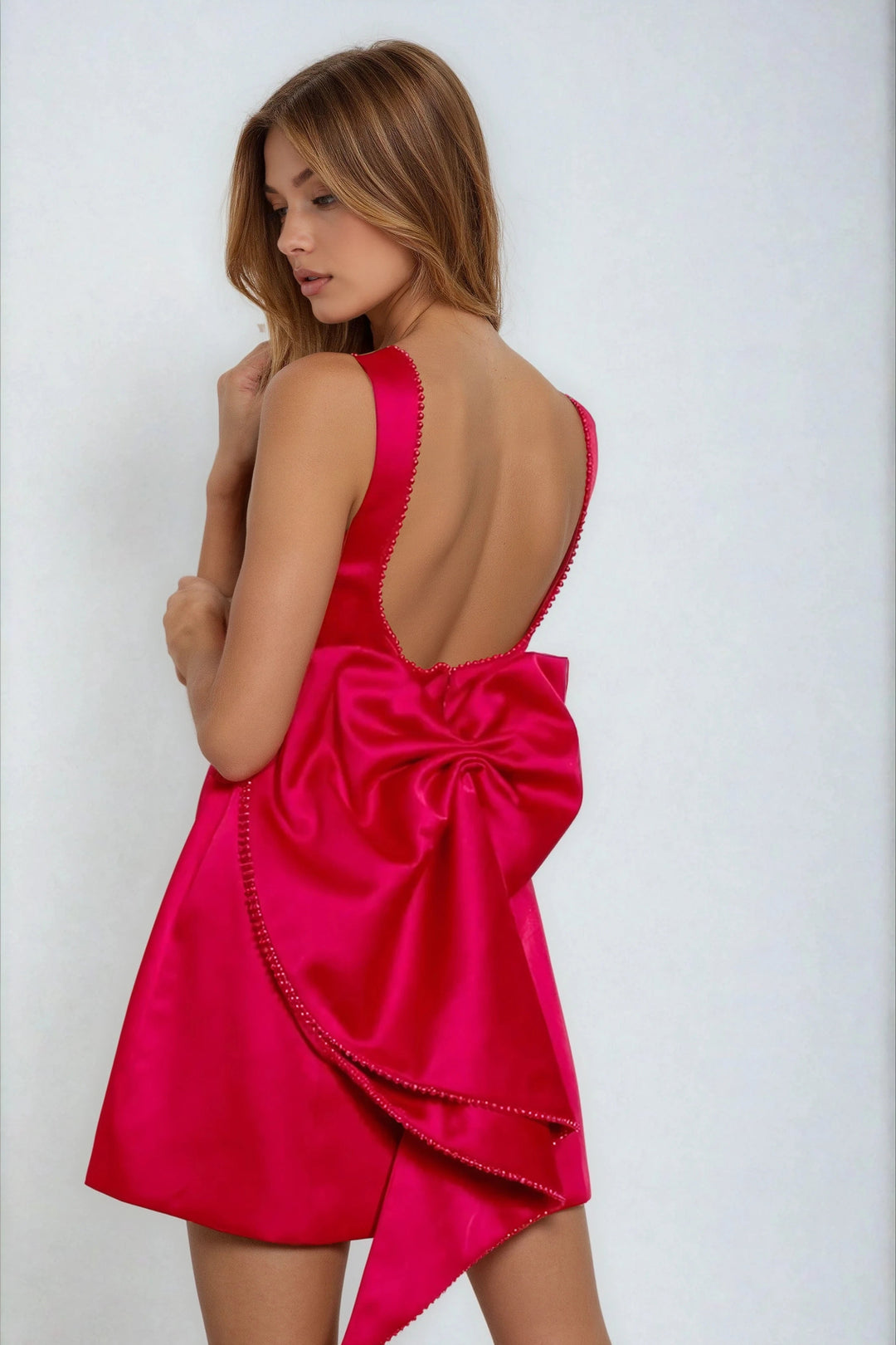 Back view red mini dress with detachable bow and pearl trim