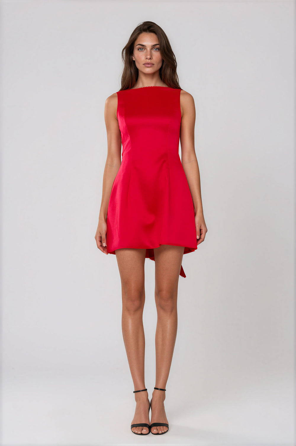 Red fit and flare mini dress with back bow on model