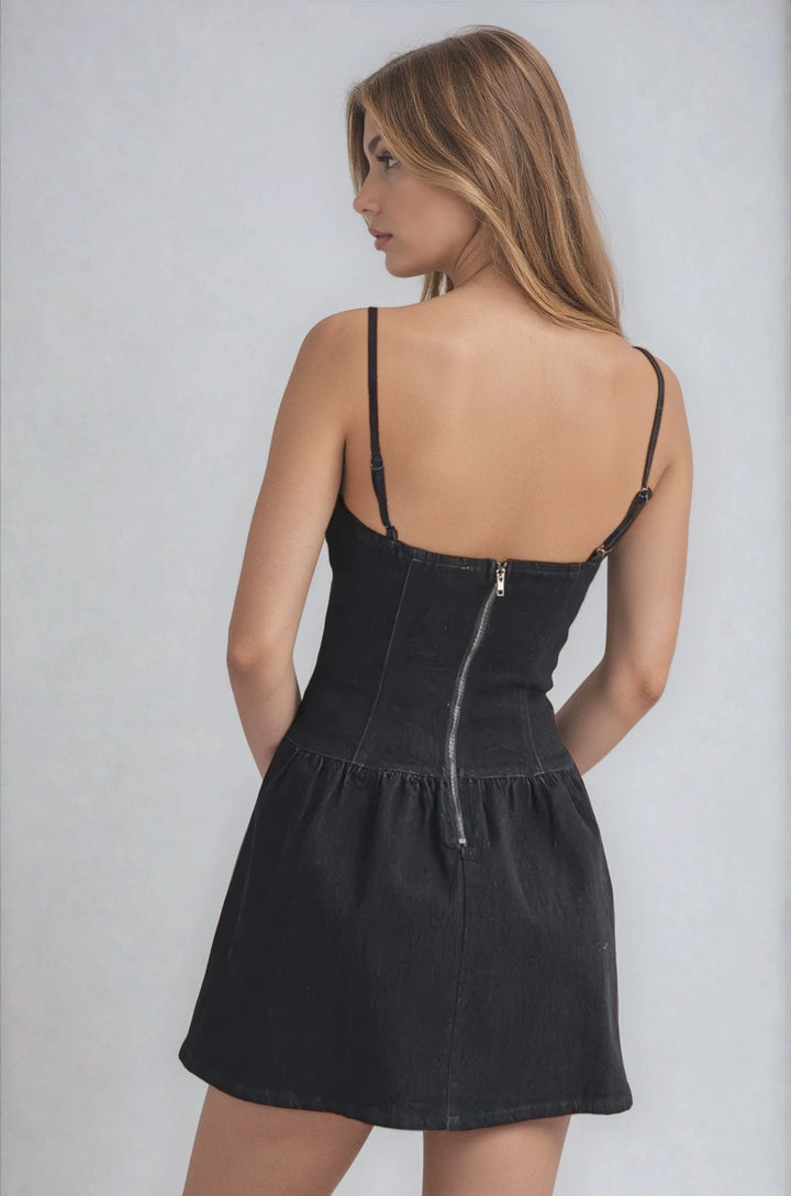 Back view dark denim mini dress with adjustable straps on model