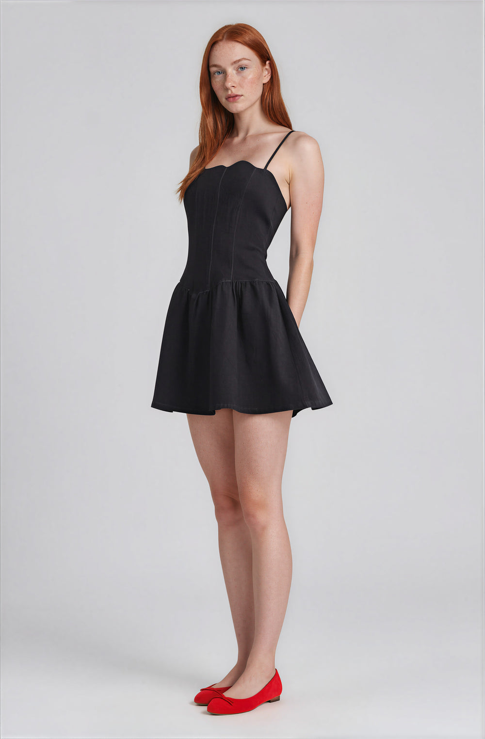 Side view dark denim flared skirt dress on model