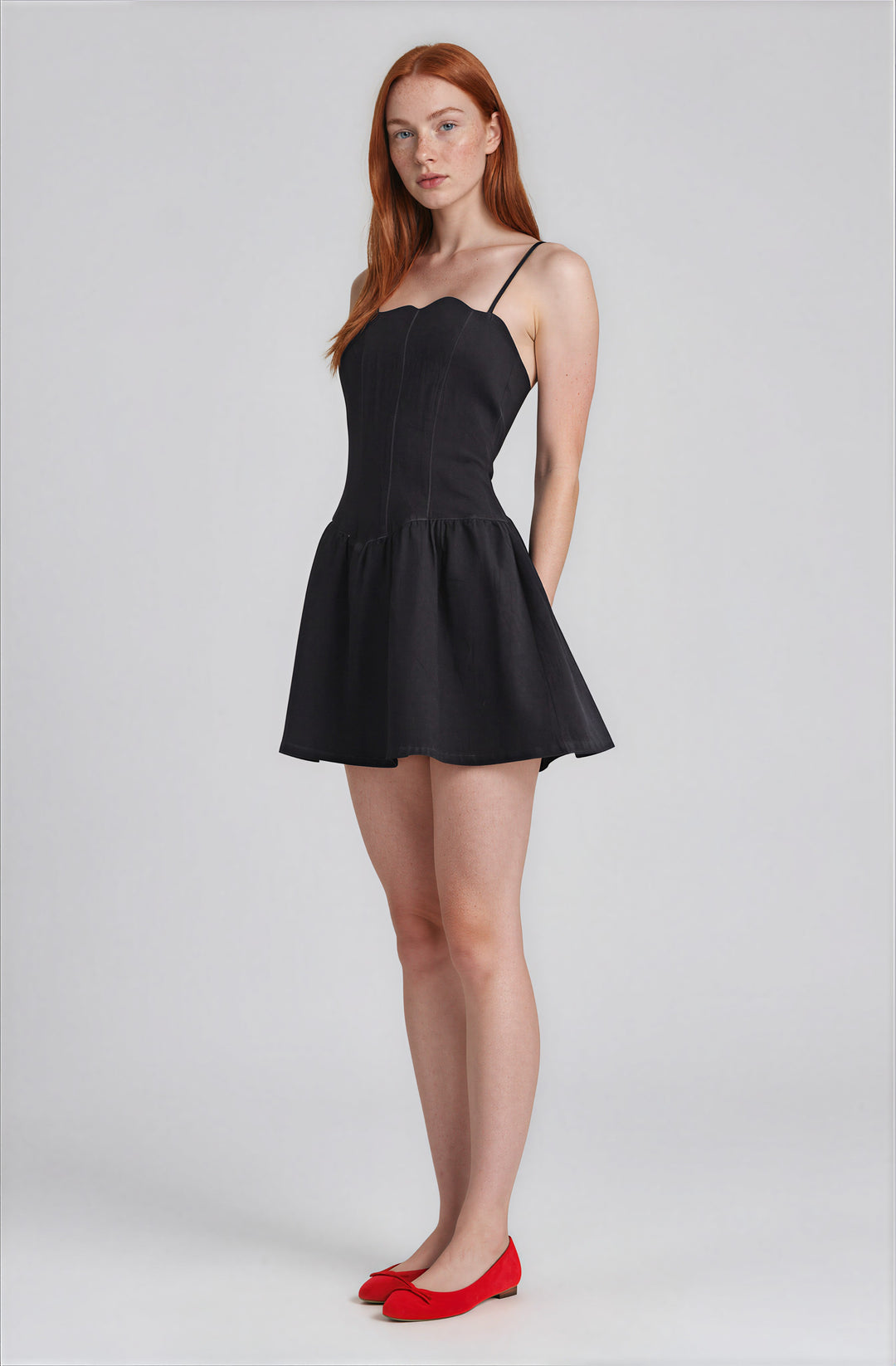 Side view dark denim flared skirt dress on model