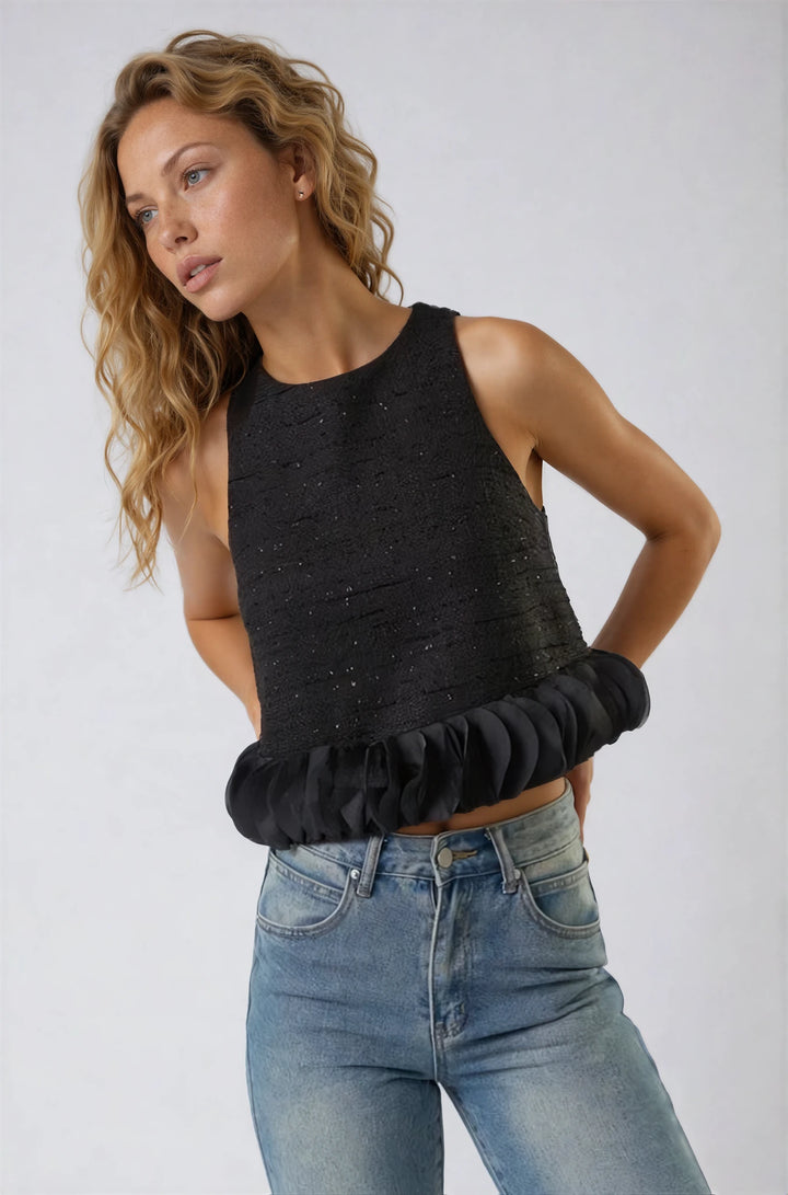 Side view black sleeveless tweed top on model