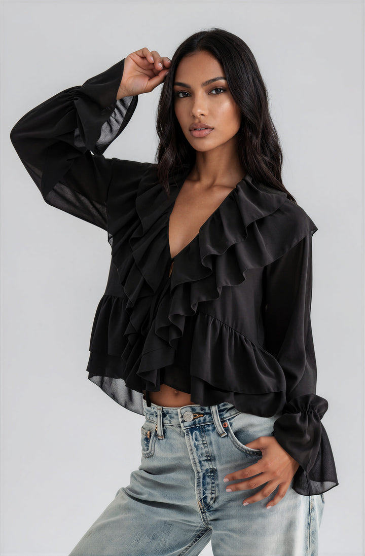 Front view black layered ruffle blouse on model