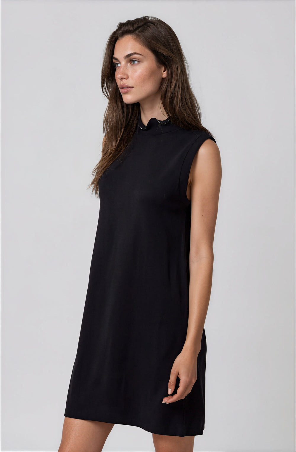Front view black knit dress with pearl neckline detail