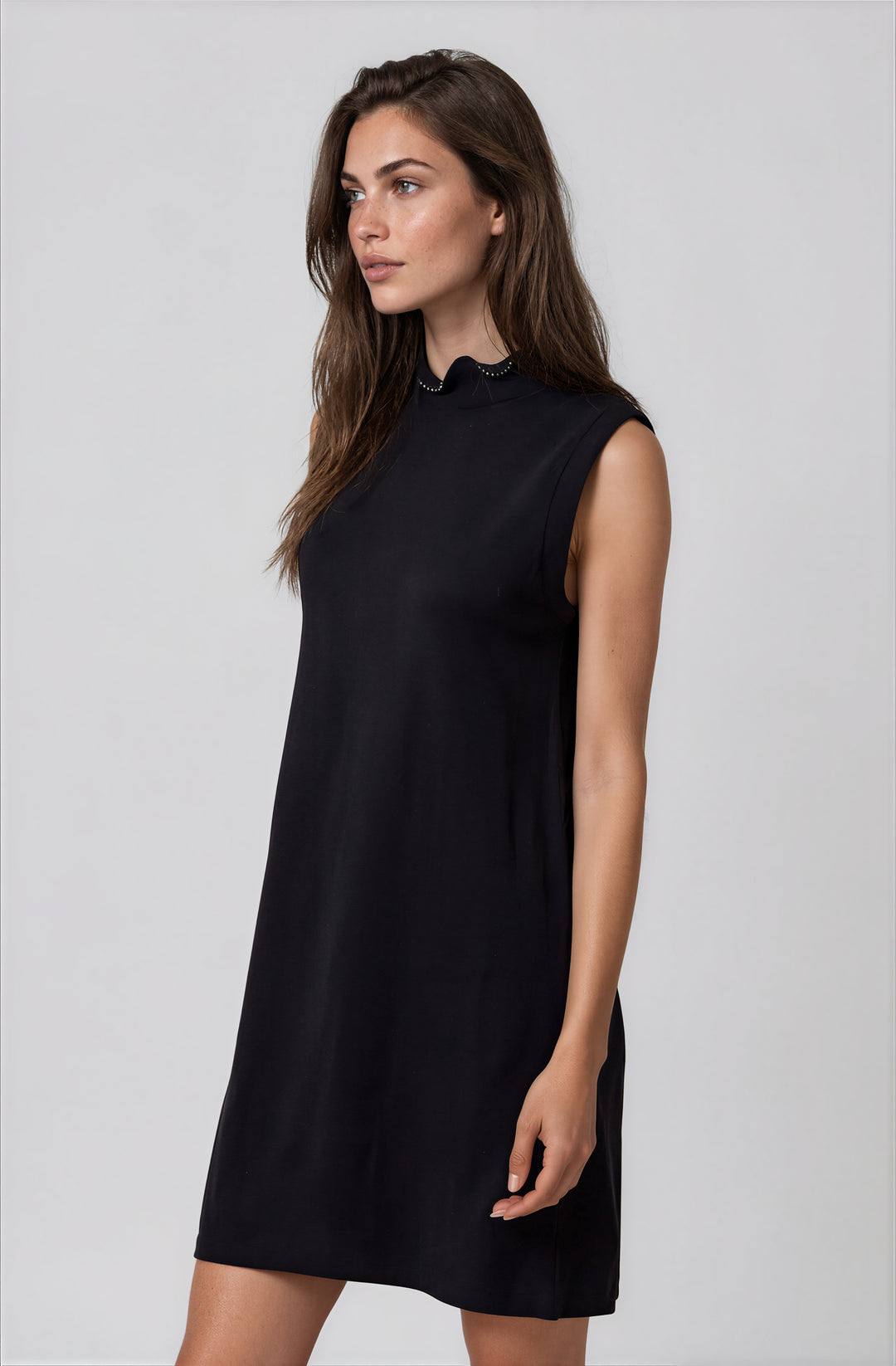 Front view black knit dress with pearl neckline detail