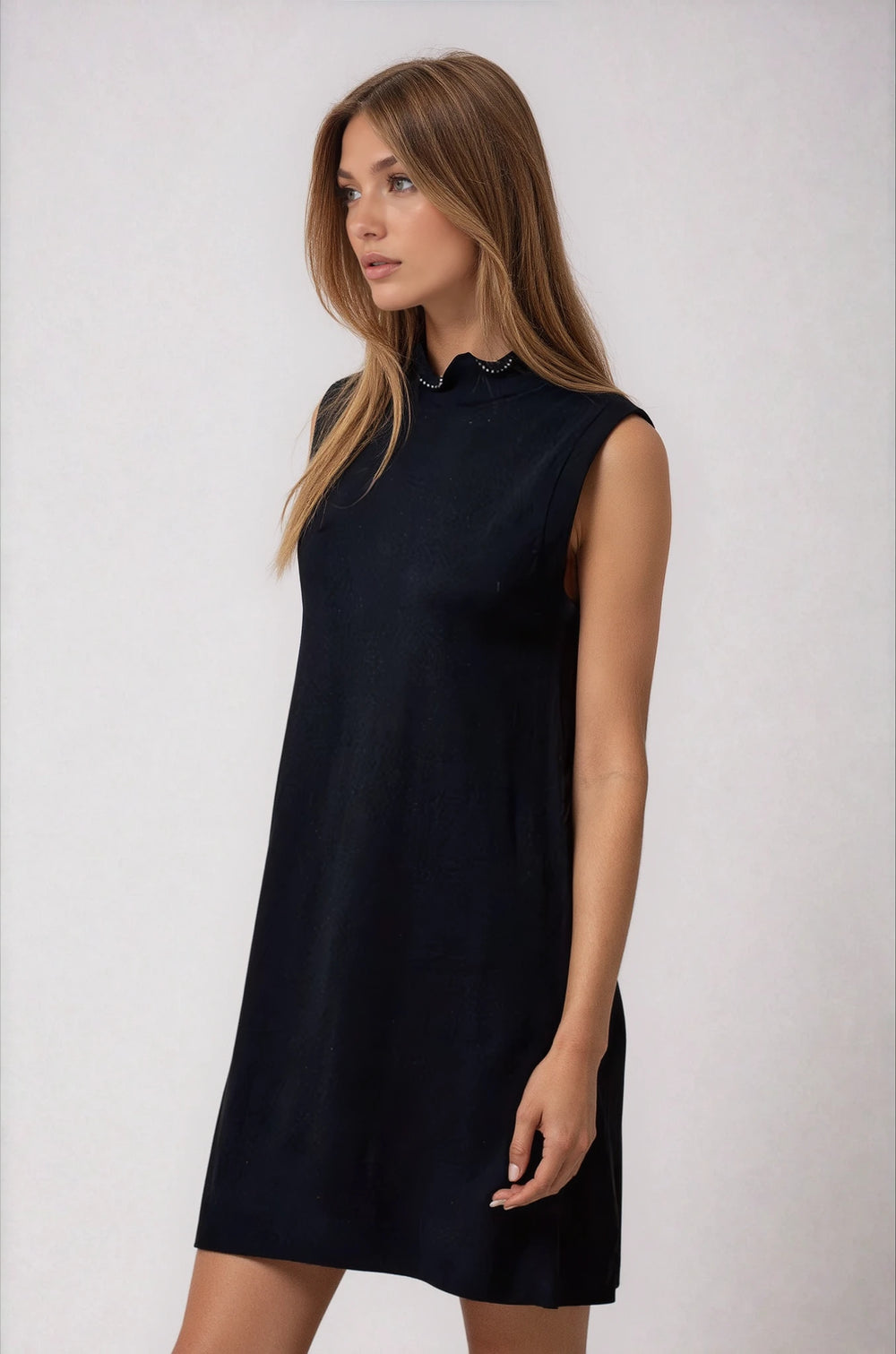 Front view black knit dress with pearl neckline detail