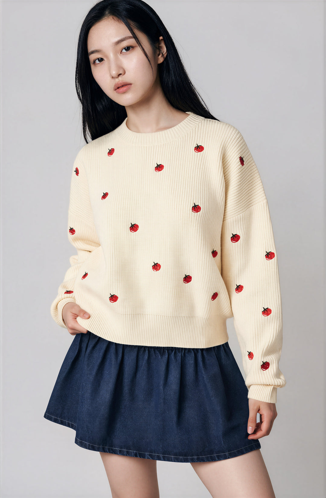 Front view cream tomato embroidered sweater on model
