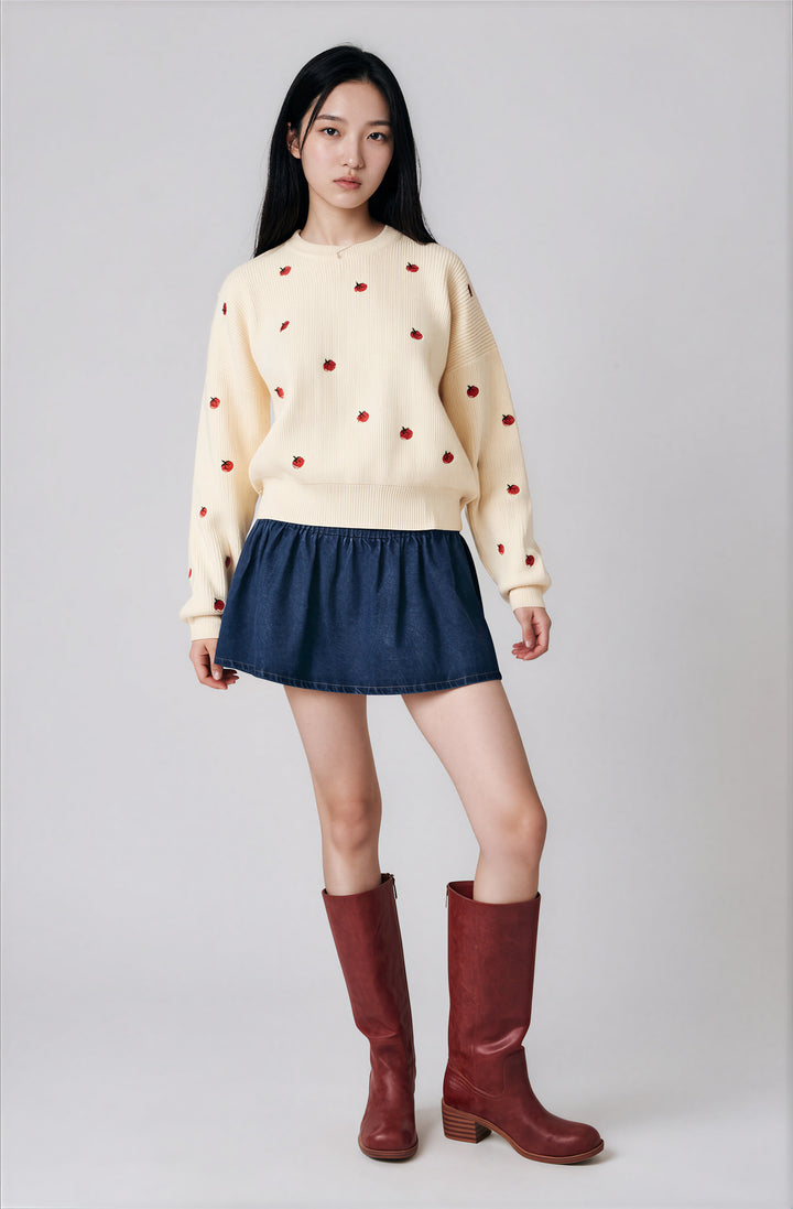 Front view cream tomato embroidered sweater on model