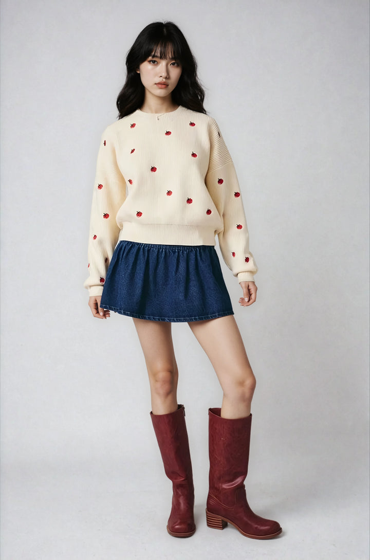 Front view cream tomato embroidered sweater on model