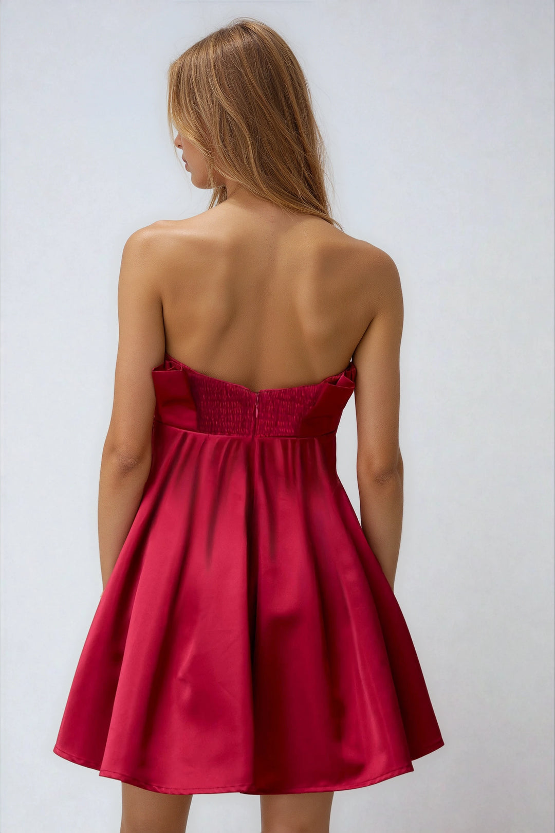 Back view wine strapless mini dress with polished finish