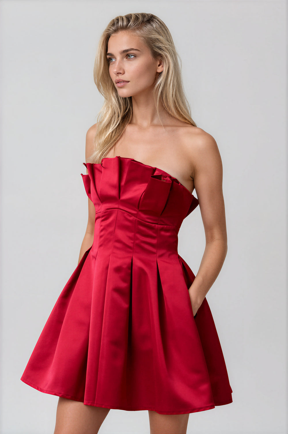 red strapless flared mini dress with pleating for holidays