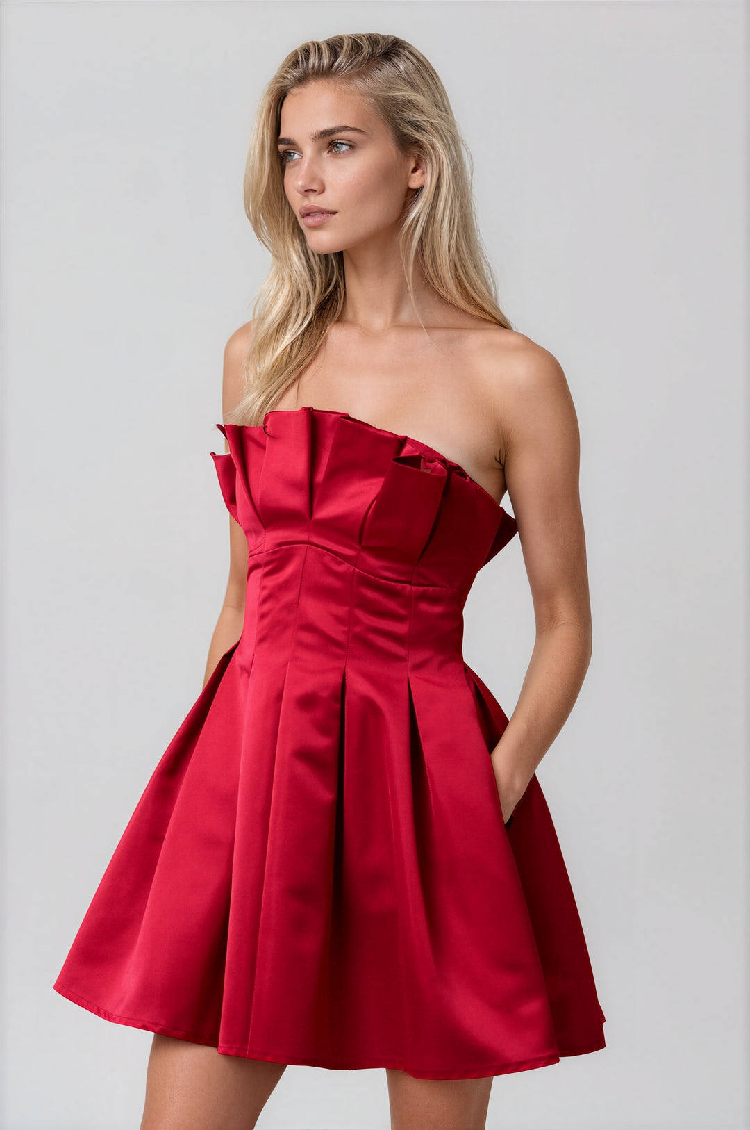 red strapless flared mini dress with pleating for holidays