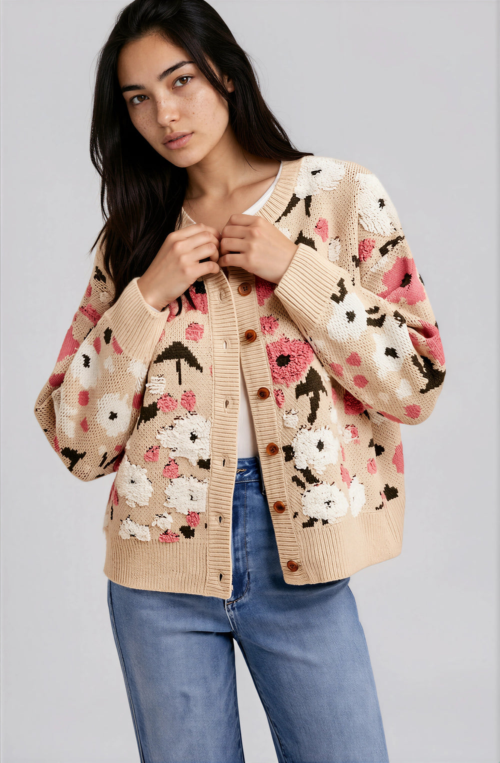 Beige floral boucle knit cardigan on model with denim