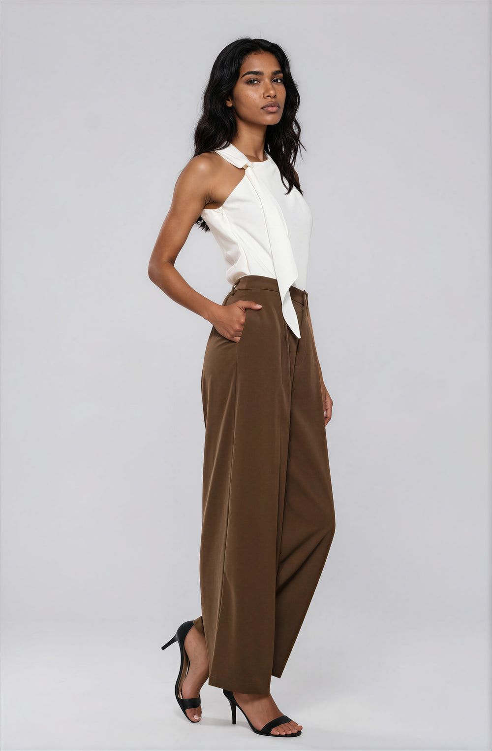 Side view ivory asymmetric draped blouse on model